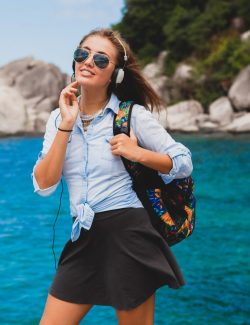 beautiful-hipster-woman-traveling-around-world-with-backpack-smiling-happy-positive-listening-music-headphones-blue-tropical-ocean-background-sunglasses-sexy-summer-vacation_285396-6054